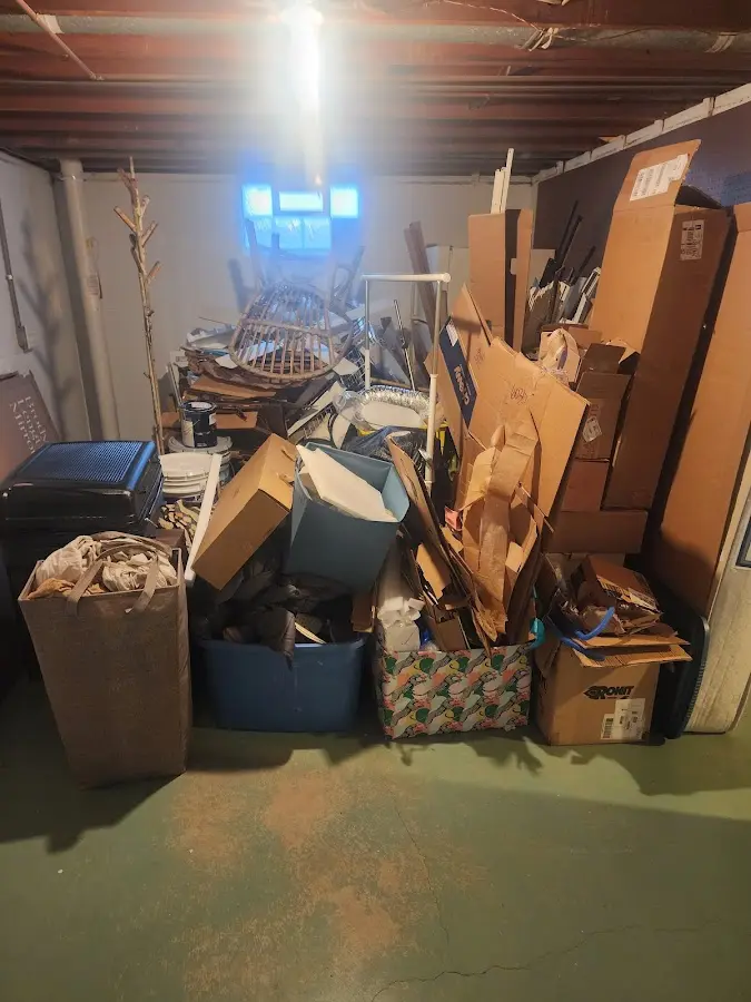 Roll-off dumpster container at job site for 2 Yard Dumpster Rental in Fraser